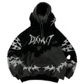 Black hoodie with white designs and text on a textured gray surface